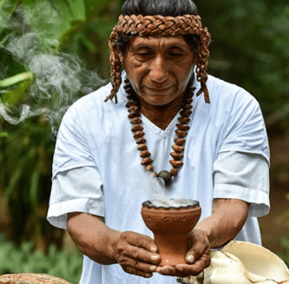 Costarican preparing chocolate like drink.
