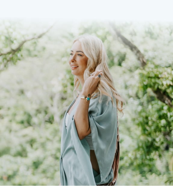 Danette May walking in nature.