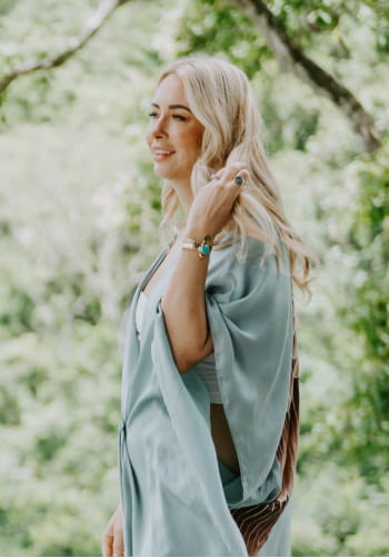 Danette May walking in nature.