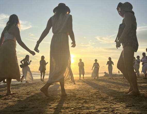 People dancing on sunset.