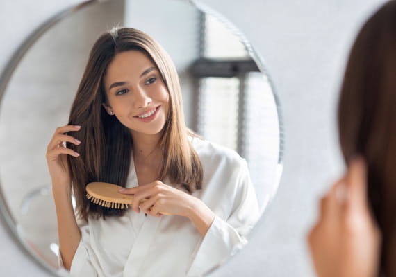 Woman brushing her hair.