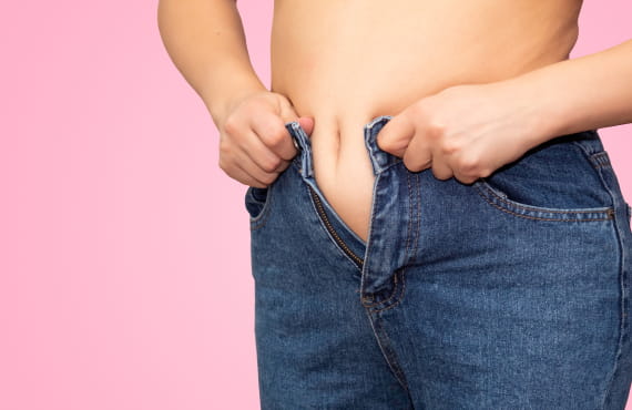 Woman putting on pants.